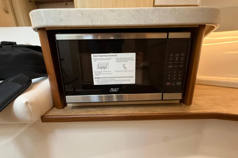 Slide: The Image of Microwave in 2026 Regal 36 Grande Coupe yacht interior kitchen area. - 109