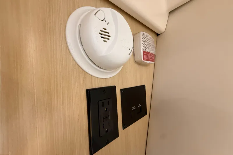 Slide: The Image of Smoke detector and electrical outlets on Regal 36 Grande Coupe 2026 interior wall. - 110