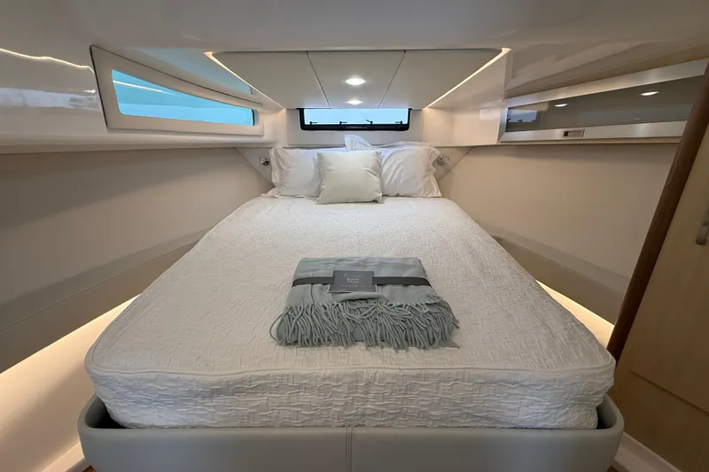 Slide: The Image of Luxurious cabin interior of 2026 Regal 36 Grande Coupe with cozy bed and modern design. - 111