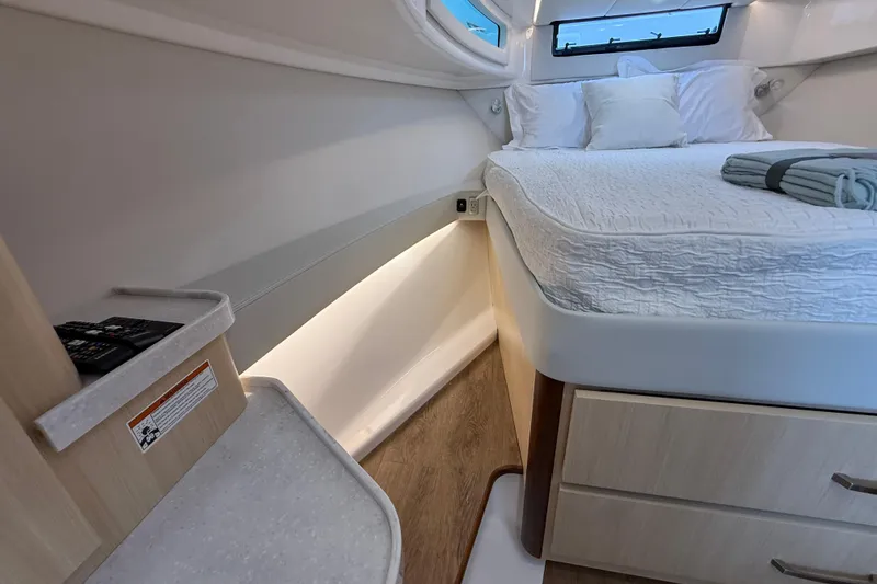Slide: The Image of Luxurious interior of 2026 Regal 36 Grande Coupe yacht with cozy bed and modern design. - 112