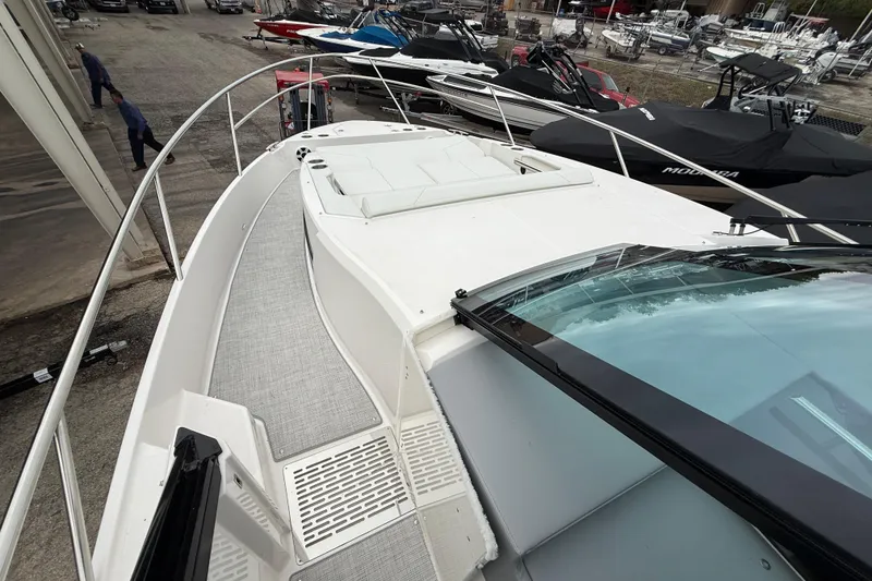 Slide: The Image of 2026 Regal 36 Grande Coupe yacht with spacious deck and sleek design. - 119