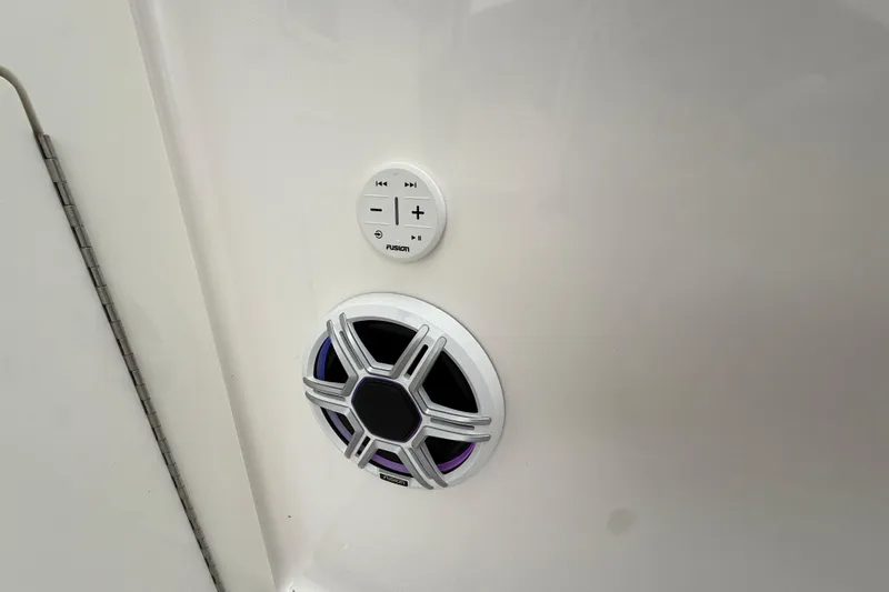 Slide: The Image of Speaker and control panel on 2026 Regal 36 Grande Coupe boat interior. - 12