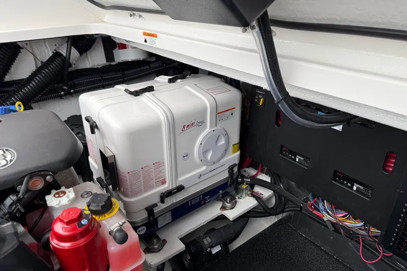 Slide: The Image of Engine compartment of 2026 Regal 36 Grande Coupe with generator and wiring. - 17