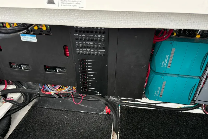 Slide: The Image of Electrical panel and wiring inside a 2026 Regal 36 Grande Coupe boat. - 18