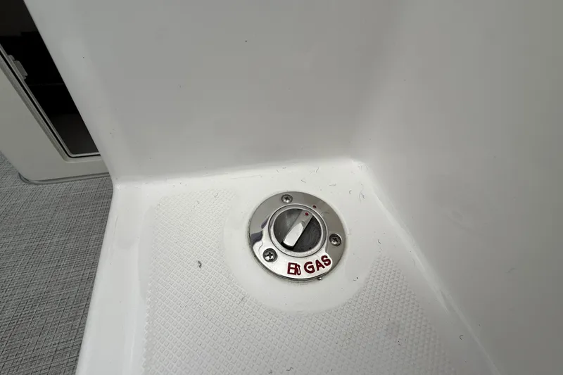 Slide: The Image of Gas cap on 2026 Regal 36 Grande Coupe boat, featuring a secure, modern design. - 22