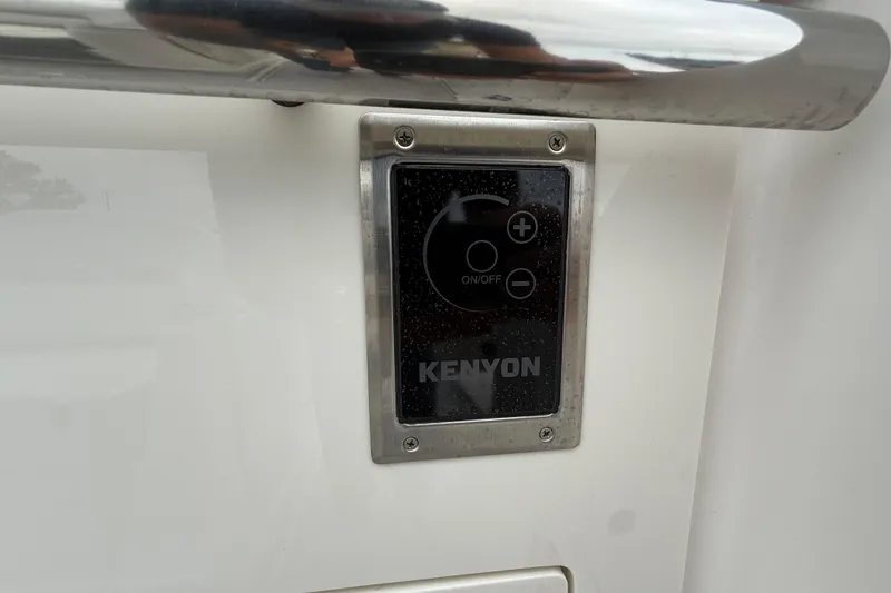 Slide: The Image of Control panel on 2026 Regal 36 Grande Coupe boat, featuring Kenyon interface. - 24