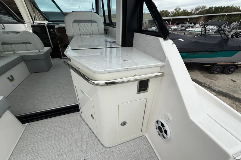 Slide: The Image of Interior of 2026 Regal 36 Grande Coupe with sleek seating and modern amenities. - 25