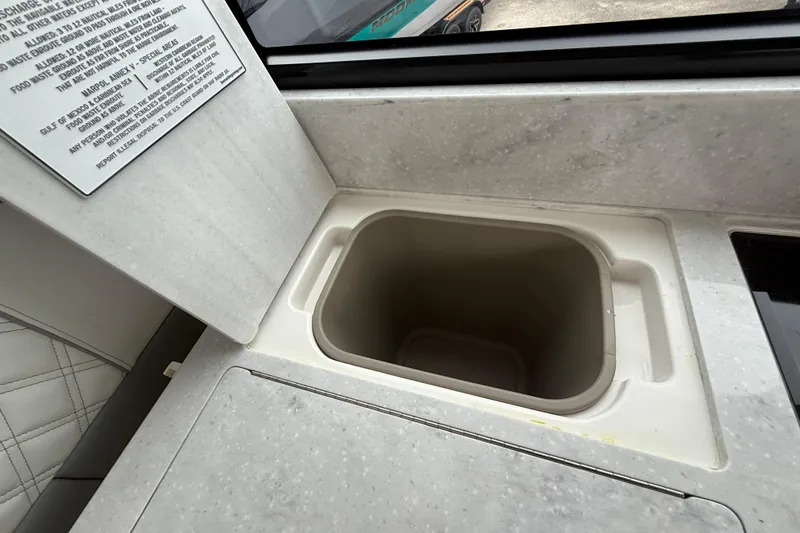 Slide: The Image of Interior of 2026 Regal 36 Grande Coupe with built-in countertop storage compartment. - 38