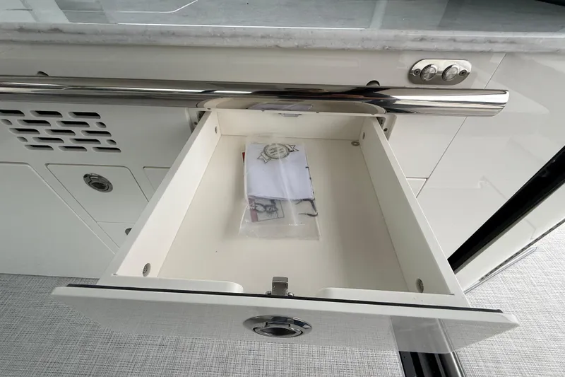 Slide: The Image of Open drawer in 2026 Regal 36 Grande Coupe yacht interior. - 40