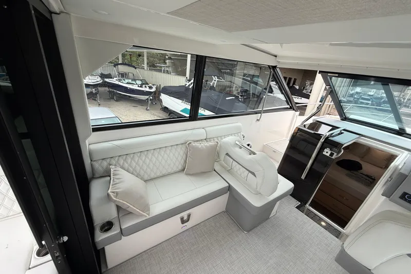 Slide: The Image of Luxurious interior of 2026 Regal 36 Grande Coupe yacht with plush seating and modern design. - 49