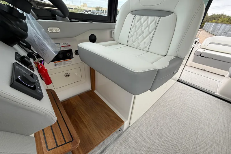Slide: The Image of Interior of 2026 Regal 36 Grande Coupe with luxurious seating and modern controls. - 56