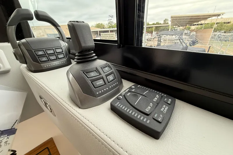 Slide: The Image of Control panel of 2026 Regal 36 Grande Coupe with joystick and buttons. - 58