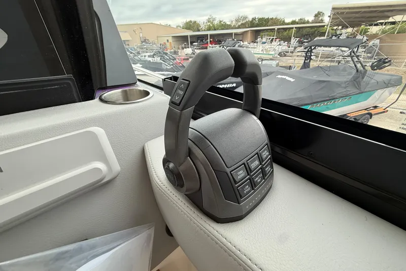 Slide: The Image of Control panel of 2026 Regal 36 Grande Coupe boat, featuring modern navigation controls. - 59