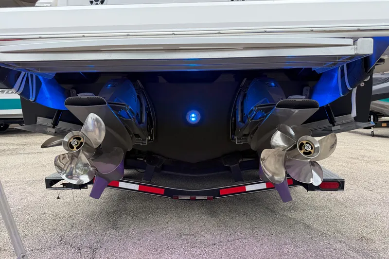 Slide: The Image of Stern view of 2026 Regal 36 Grande Coupe with dual propellers and blue lighting. - 6