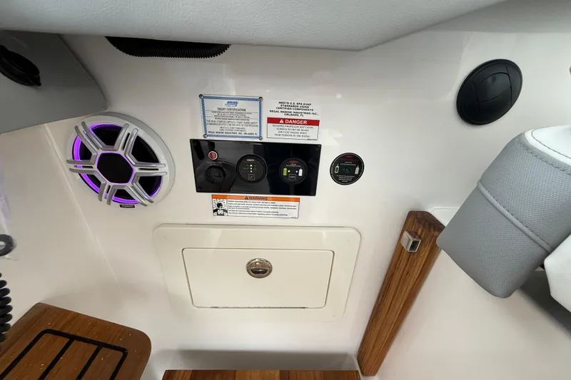 Slide: The Image of Control panel and speaker on 2026 Regal 36 Grande Coupe yacht interior. - 60