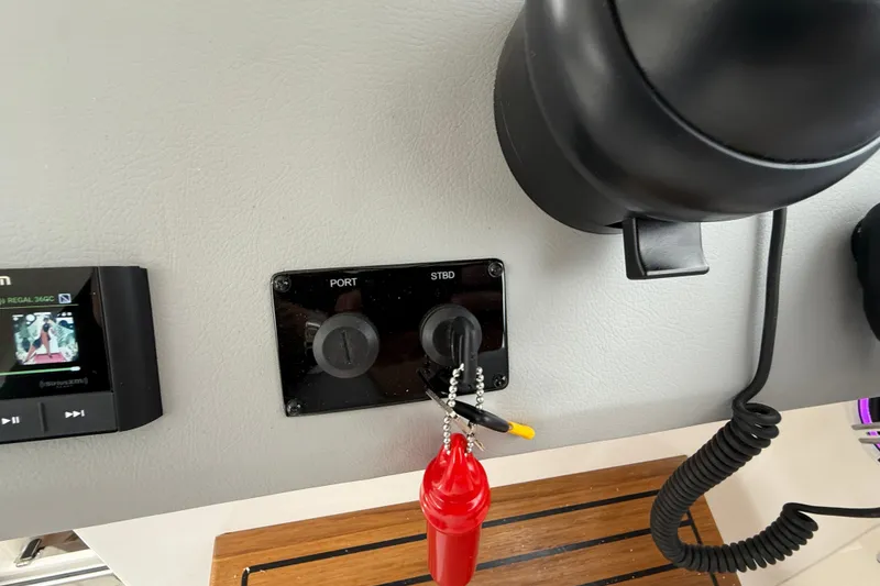 Slide: The Image of Control panel of 2026 Regal 36 Grande Coupe with port and starboard switches. - 63