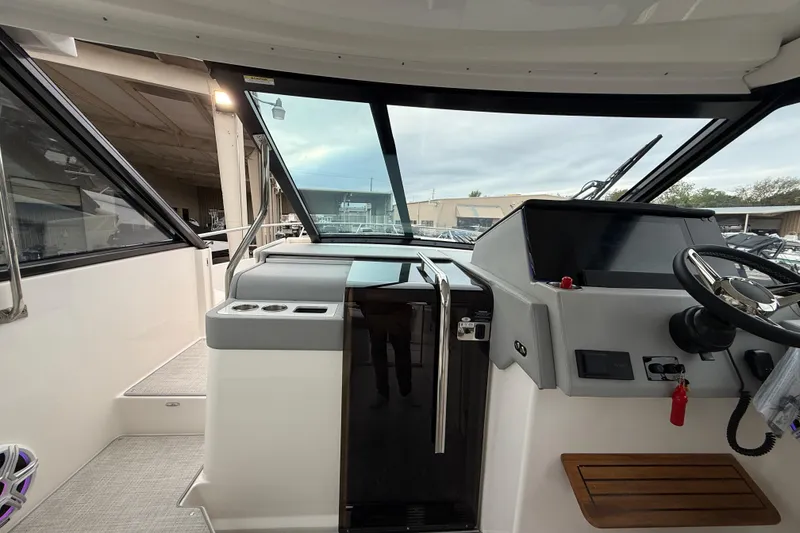 Slide: The Image of Interior view of 2026 Regal 36 Grande Coupe boat cockpit with modern controls. - 72