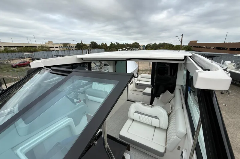 Slide: The Image of 2026 Regal 36 Grande Coupe luxury yacht with spacious seating and modern design. - 77