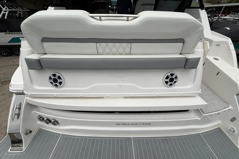 Slide: The Image of 2026 Regal 36 Grande Coupe boat with sleek seating and integrated speakers. - 8