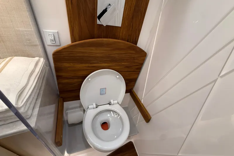 Slide: The Image of Luxury bathroom in 2026 Regal 36 Grande Coupe yacht with modern toilet design. - 84