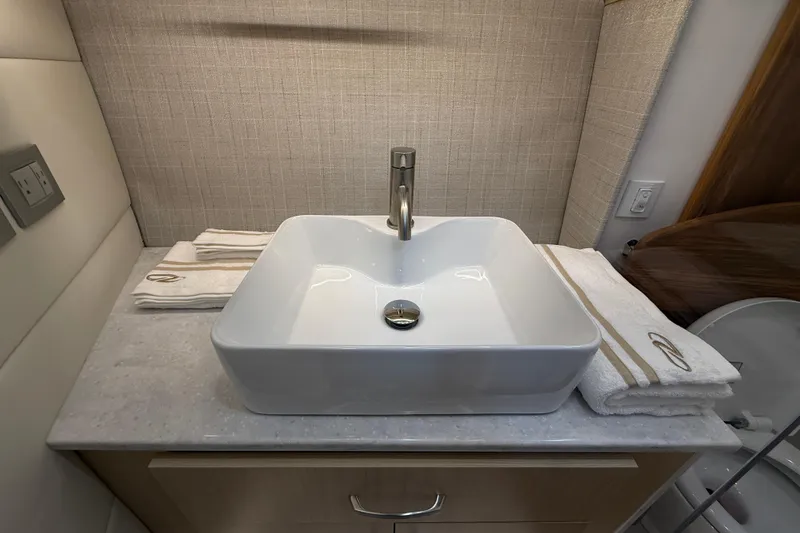 Slide: The Image of Modern bathroom sink in 2026 Regal 36 Grande Coupe yacht, featuring elegant design and luxury amenities. - 86
