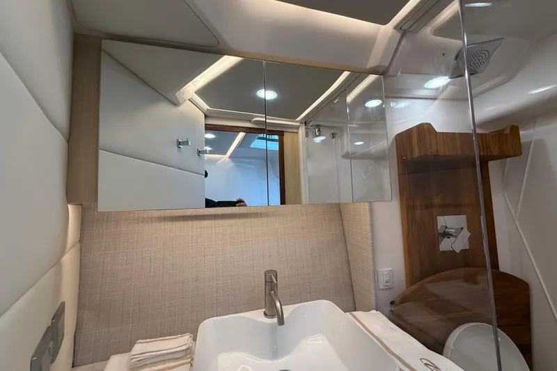 Slide: The Image of Luxurious bathroom interior of 2026 Regal 36 Grande Coupe yacht, featuring modern fixtures and elegant design. - 87