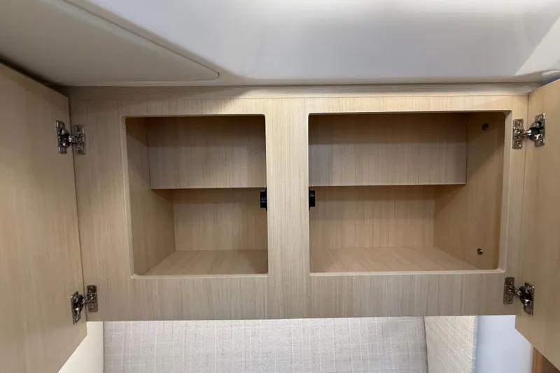 Slide: The Image of Empty wooden cabinets inside 2026 Regal 36 Grande Coupe yacht. - 88