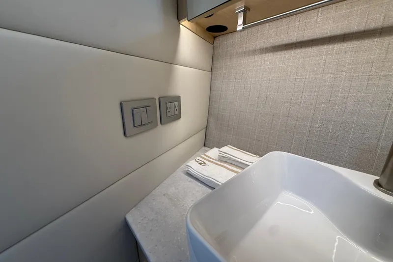 Slide: The Image of Modern bathroom sink area in 2026 Regal 36 Grande Coupe yacht. - 89