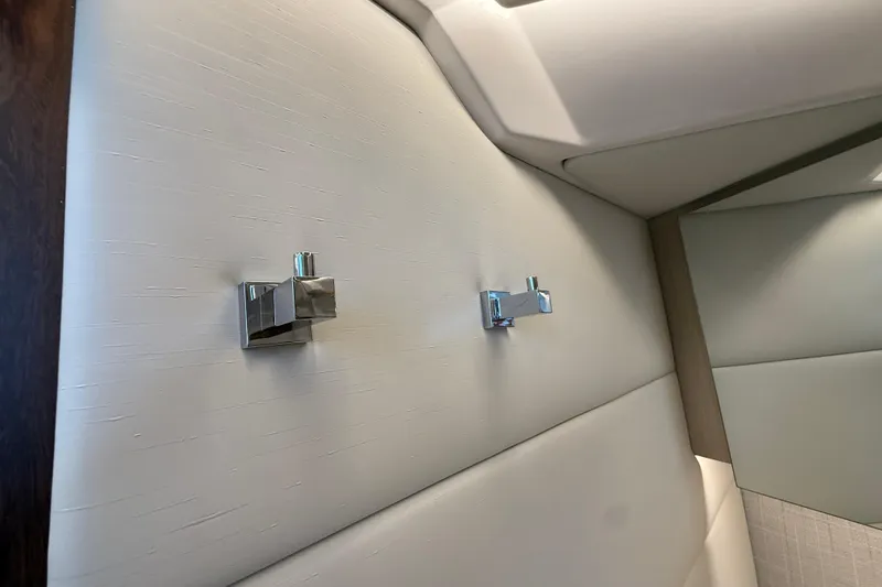 Slide: The Image of Interior of 2026 Regal 36 Grande Coupe with modern wall hooks. - 92