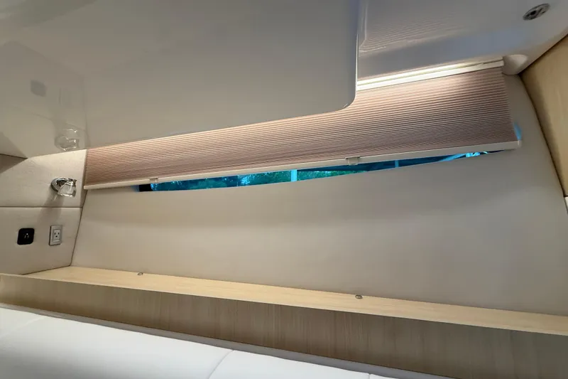 Slide: The Image of Interior of 2026 Regal 36 Grande Coupe with modern window shade and sleek design. - 95