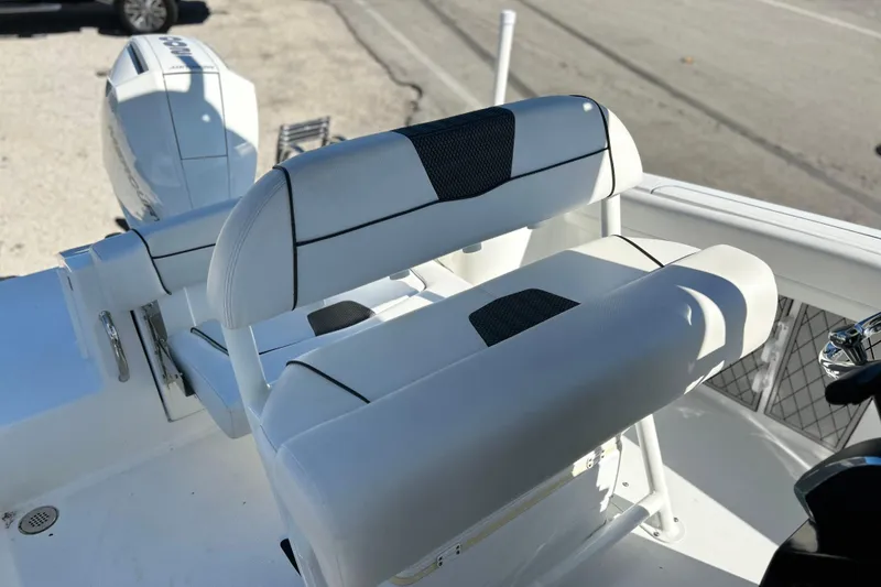 Slide: The Image of 2023 Wellcraft 222 Scarab Offshore boat seating and engine detail. - 15