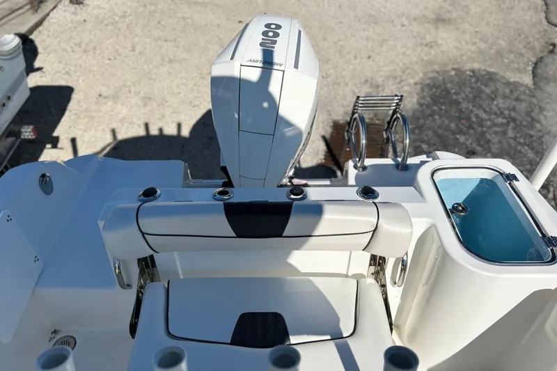 Slide: The Image of 2023 Wellcraft 222 Scarab Offshore boat interior with engine and seating area. - 17