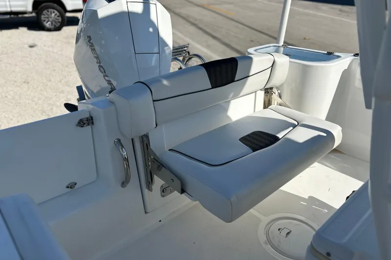Slide: The Image of 2023 Wellcraft 222 Scarab Offshore boat interior with foldable seating and Mercury engine. - 18