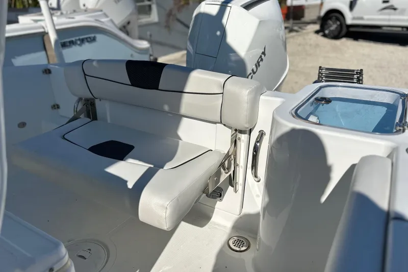 Slide: The Image of 2023 Wellcraft 222 Scarab Offshore boat interior with seating and Mercury engine. - 20