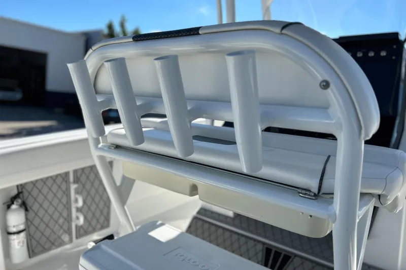 Slide: The Image of 2023 Wellcraft 222 Scarab Offshore boat with rod holders and seating detail. - 22