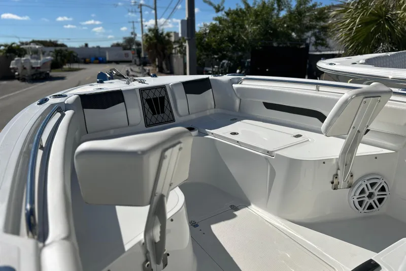 Slide: The Image of 2023 Wellcraft 222 Scarab Offshore boat interior with seating and storage compartments. - 26