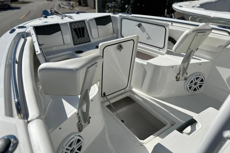 Slide: The Image of 2023 Wellcraft 222 Scarab Offshore boat interior with storage compartments and seating. - 31