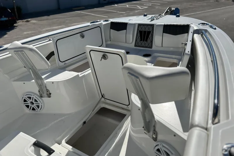 Slide: The Image of 2023 Wellcraft 222 Scarab Offshore boat interior with seating and storage compartments. - 32