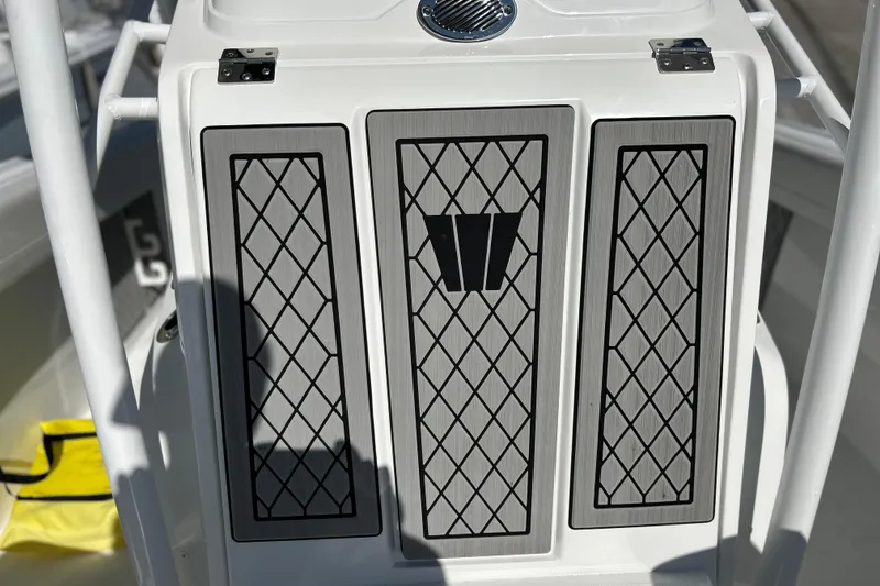 Slide: The Image of 2023 Wellcraft 222 Scarab Offshore boat console with diamond-patterned panels. - 37