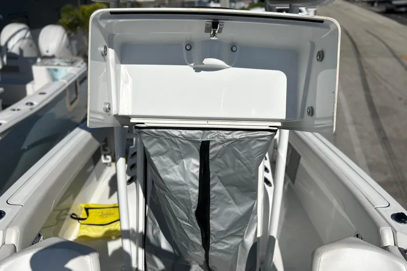 Slide: The Image of 2023 Wellcraft 222 Scarab Offshore boat interior with open storage compartment. - 39