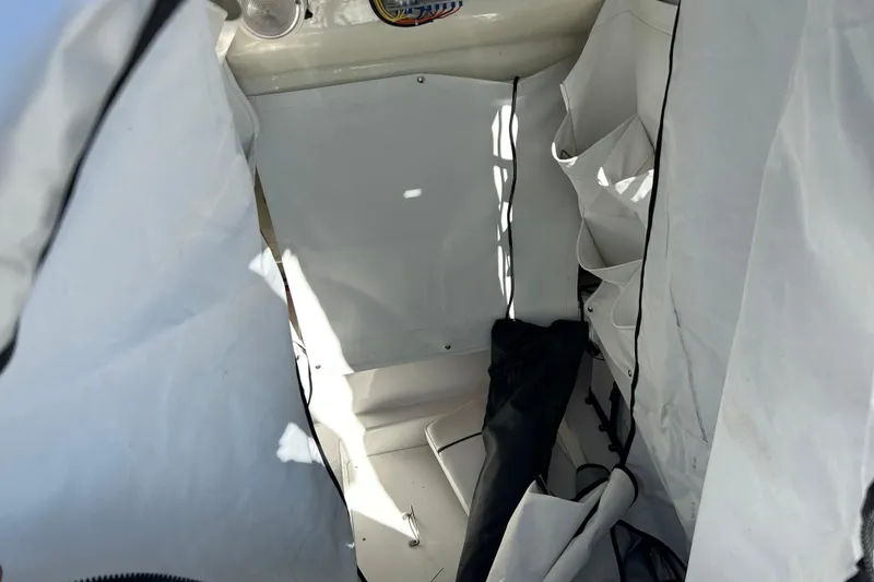 Slide: The Image of Interior view of 2023 Wellcraft 222 Scarab Offshore boat with storage compartments. - 41