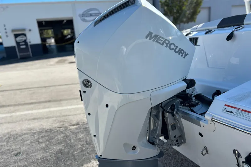 Slide: The Image of 2023 Wellcraft 222 Scarab Offshore with Mercury outboard engine, parked outdoors. - 44