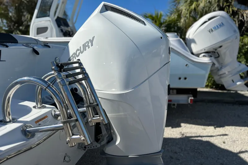Slide: The Image of 2023 Wellcraft 222 Scarab Offshore with Mercury outboard engine, parked outdoors. - 45