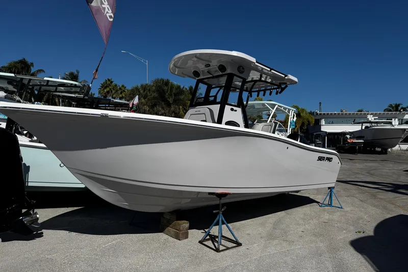 Slide: The Image of 2026 Sea Pro 242 Center Console boat displayed outdoors on stands. - 1