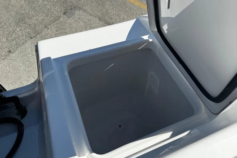 Slide: The Image of Open storage compartment on 2026 Sea Pro 242 Center Console boat. - 12