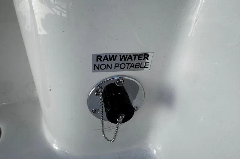 Slide: The Image of 2026 Sea Pro 242 Center Console raw water non-potable label on white surface. - 14