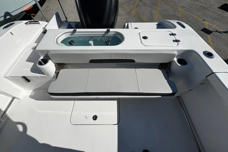 Slide: The Image of 2026 Sea Pro 242 Center Console boat interior with seating and storage features. - 16