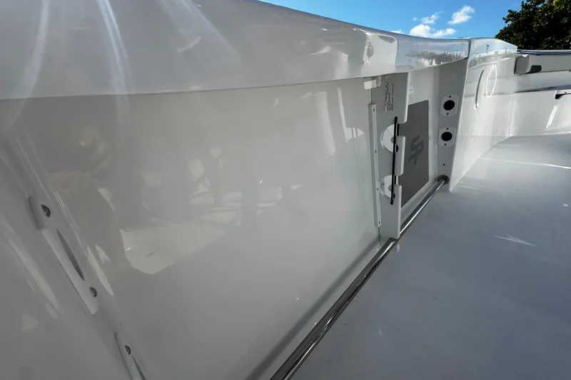 Slide: The Image of 2026 Sea Pro 242 Center Console boat interior with sleek white finish and stainless steel details. - 17