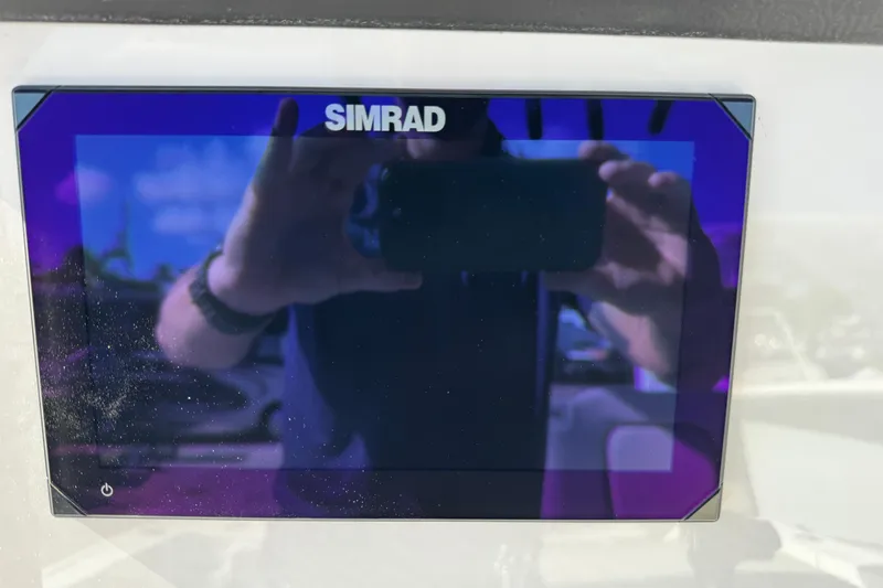 Slide: The Image of Simrad display on 2026 Sea Pro 242 Center Console boat dashboard. - 21