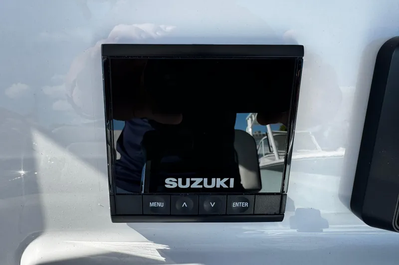 Slide: The Image of Suzuki control panel on 2026 Sea Pro 242 Center Console boat. - 22